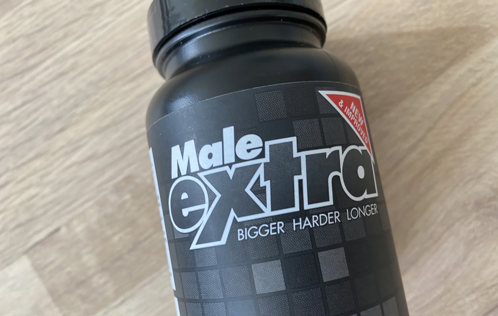 Male Extra bottle on table
