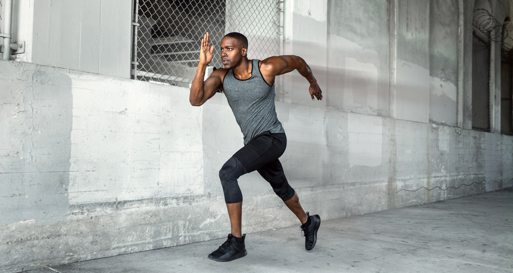 Athletic man doing HIIT sprints.