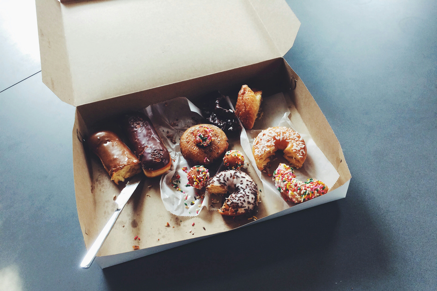 An open box of half-eaten donuts